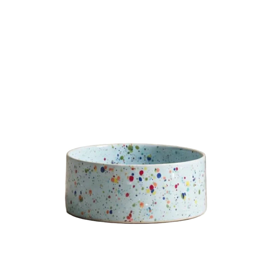 Speckled blue ceramic bowl on a white background