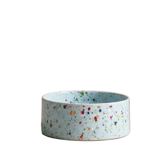 Speckled blue ceramic bowl on a white background